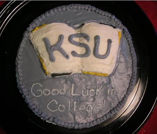 Book Cake.JPG - For a graduation, make a book cake. Press a 3/4-inch layer of clay into the bottom of a round pan. Form a small indention where you would like the spine of the book to be. Position your finger vertically along the spine and move towards the edge of one of the pages, forming the largest indention towards the center of the "page". Repeat until you are happy with your inverse book shape. Spray the clay and pan with cooking spray, and pour cake batter to a level about 1 inch above the highest portion of the clay. Bake until done, loosen the cake from the sides of the pan, and invert the pan.Added by: Admin.